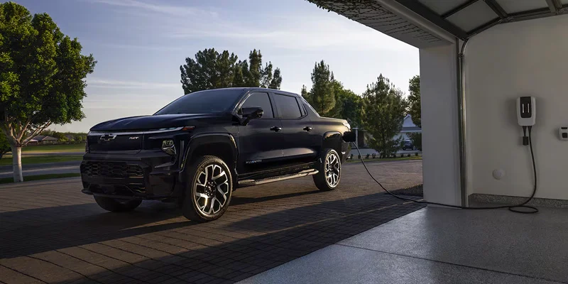 Chevy EV Maintenance with image of Chevy Silverado EV at home charger
